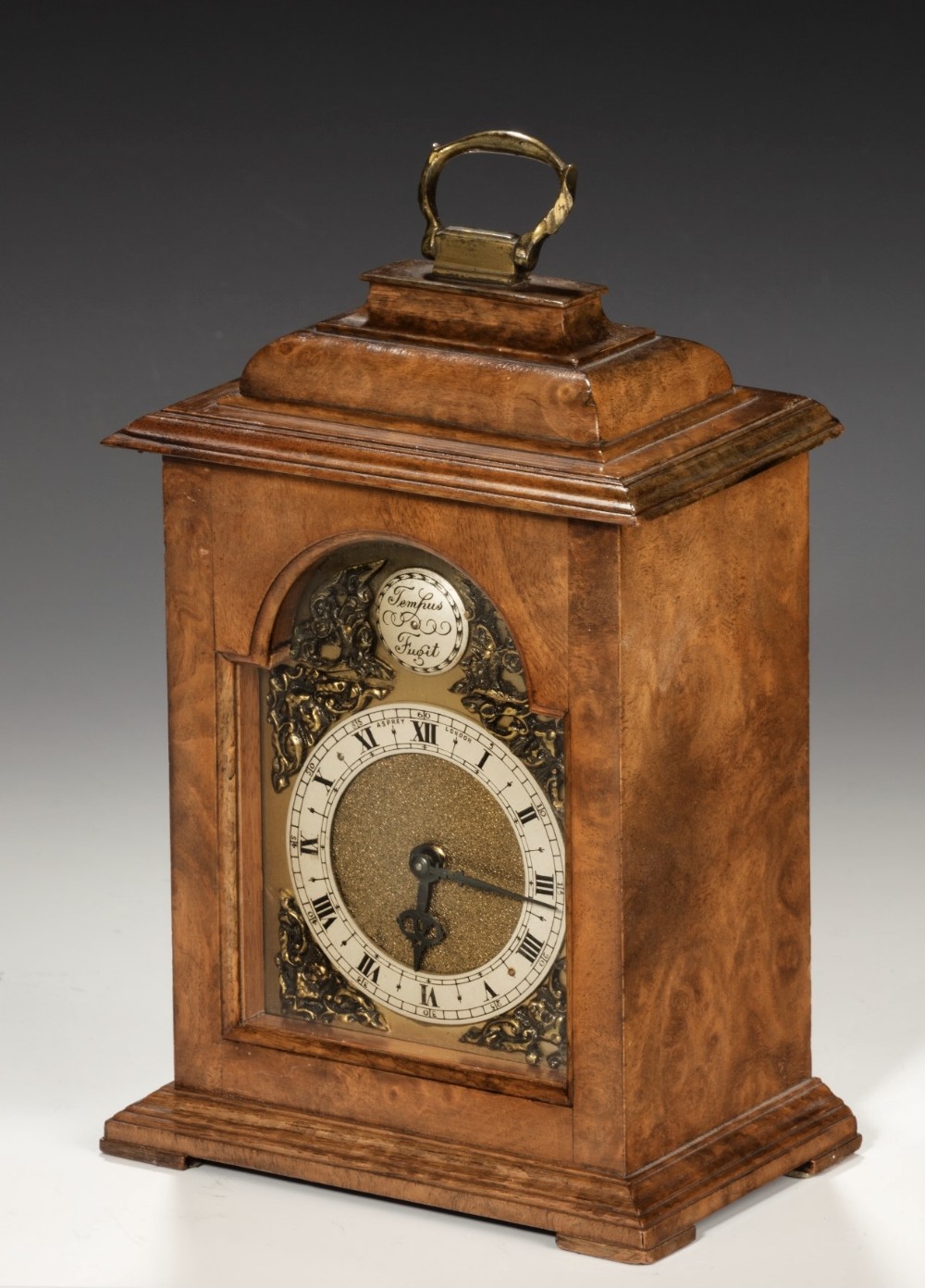 A Miniature Walnut Bracket Clock By Aspreys of London.