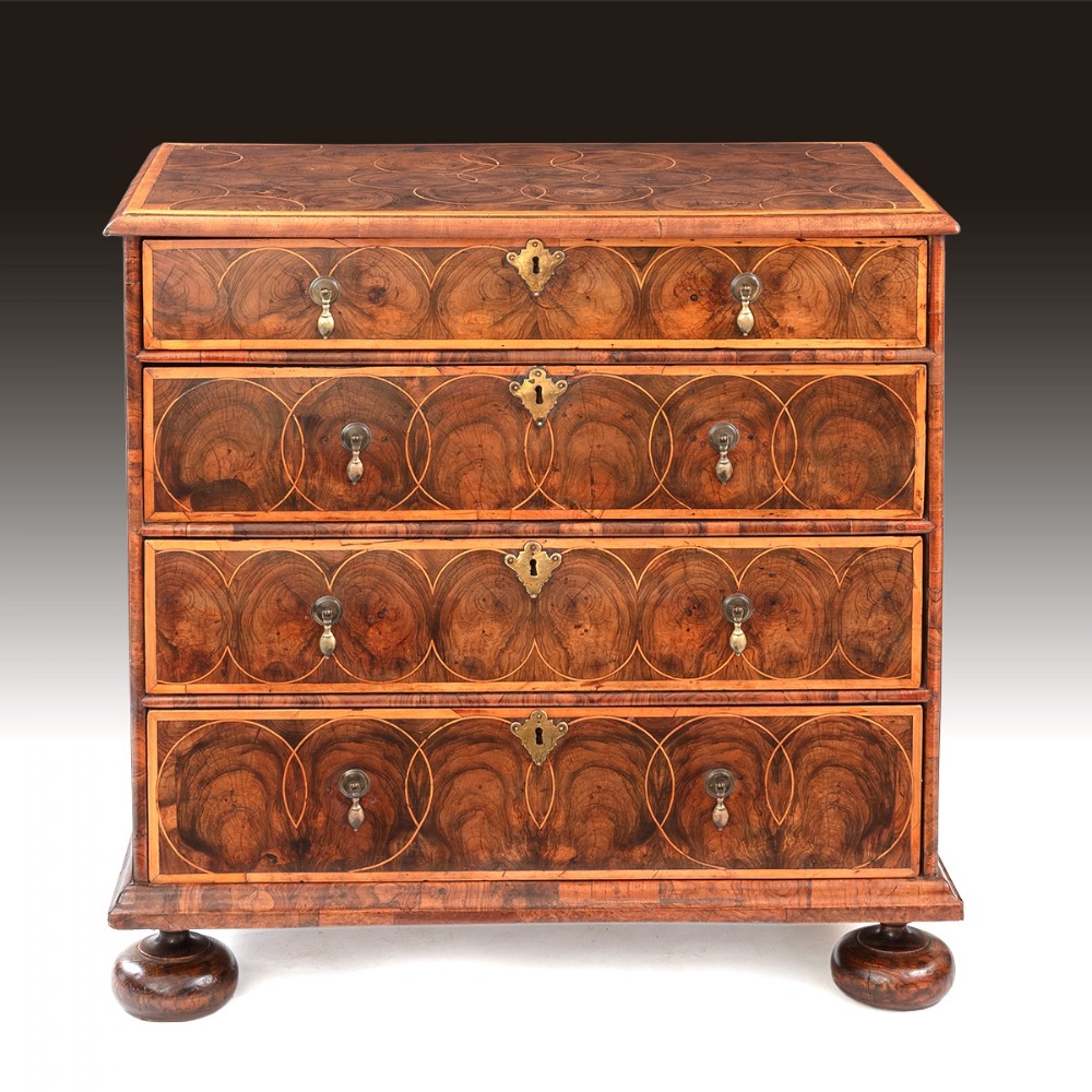A superb William & Mary period oyster veneered chest