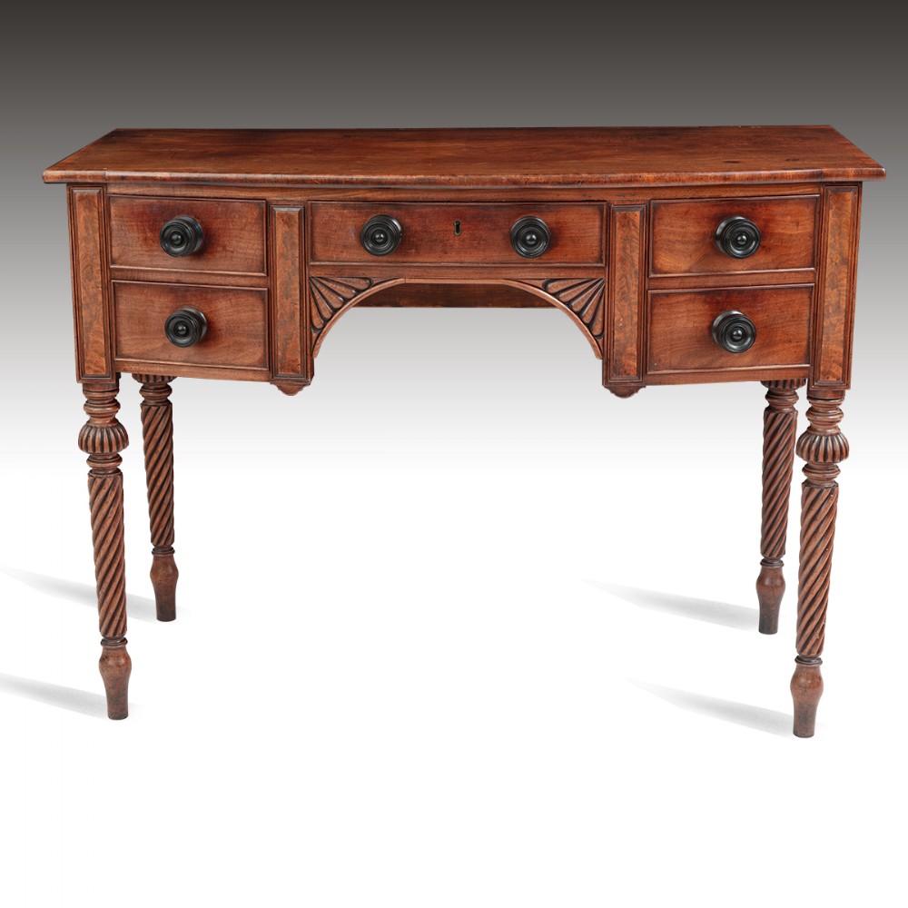 A Regency period mahogany bow fronted dressing table