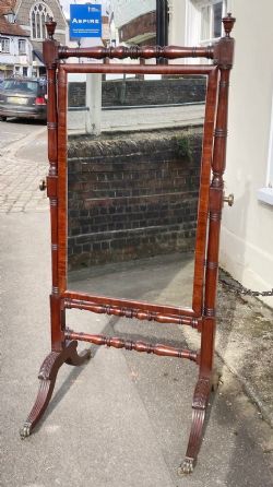 A REGENCY PERIOD CHEVAL MIRROR ATTRIBUTED TO GILLOW