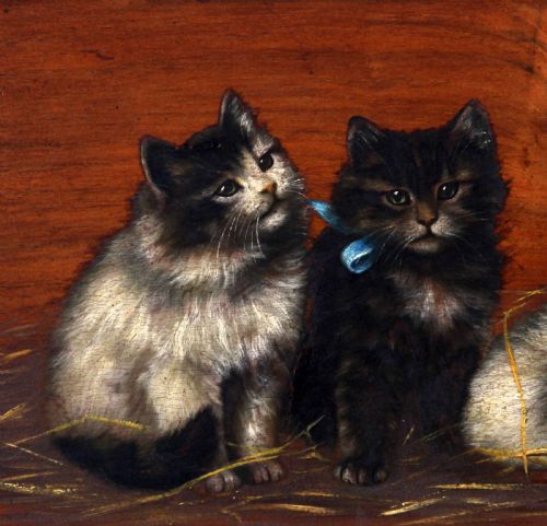 fig 2. A horizontal oil painting depicting four fluffy kittens resting on straw against a wooden background, set within a heavily carved gilt frame.