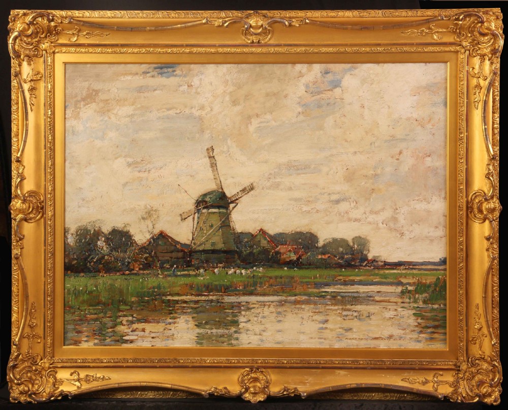 A large oil painting depicting a green Dutch polder landscape with a central windmill under a cloudy sky, framed in an ornate gold gilt frame.