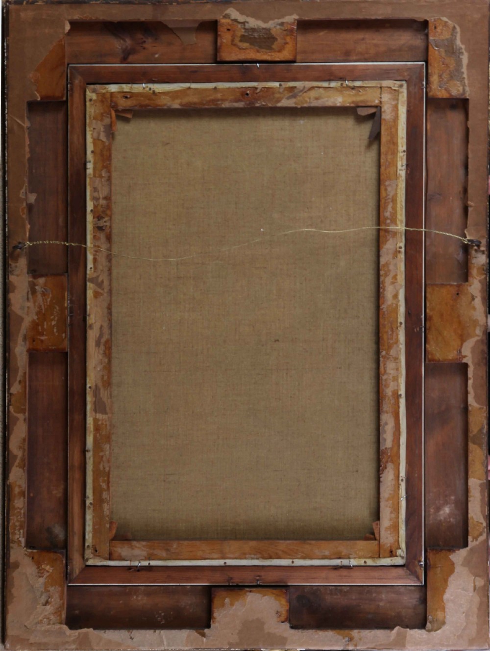 An antique oil painting depicting a whitewashed rural cottage with figures in the courtyard, housed in a molded gold gilded frame. View VII