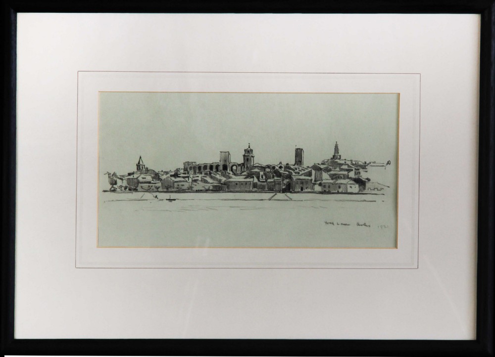 A monochrome pencil drawing depicting the panoramic skyline and architectural features of Arles across a riverbank, signed and dated 1921 by Fred Lawson. View II