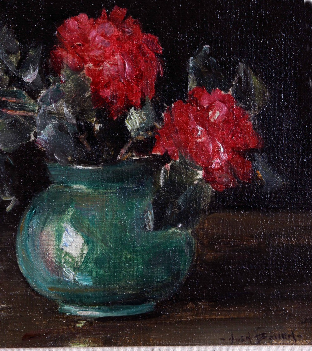 A framed oil painting depicting deep red roses arranged in a green ceramic vase against a dark background, set within an ornate gilt swept frame. View VI