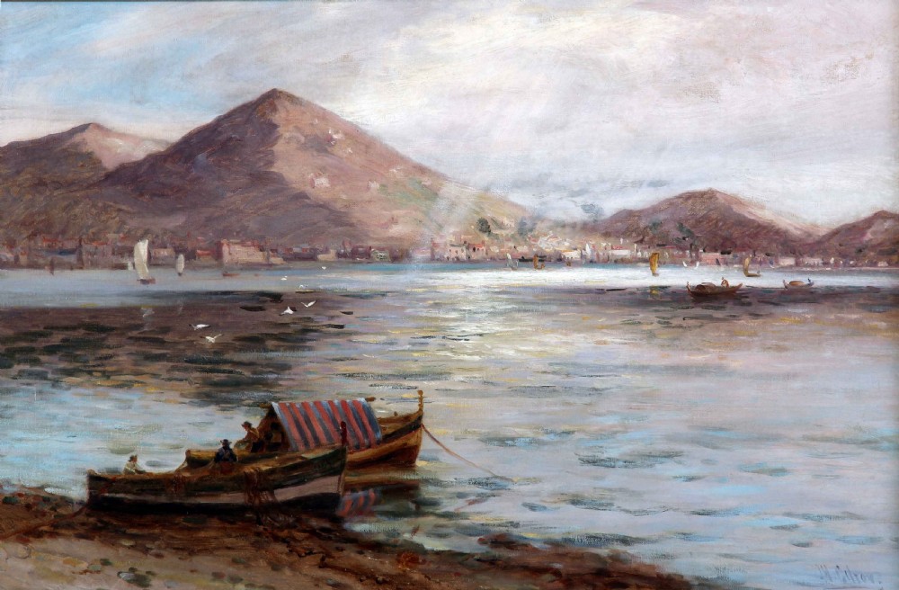 An antique oil painting depicting small fishing boats anchored along a Mediterranean shoreline with a mountain backdrop and coastal town in the distance.