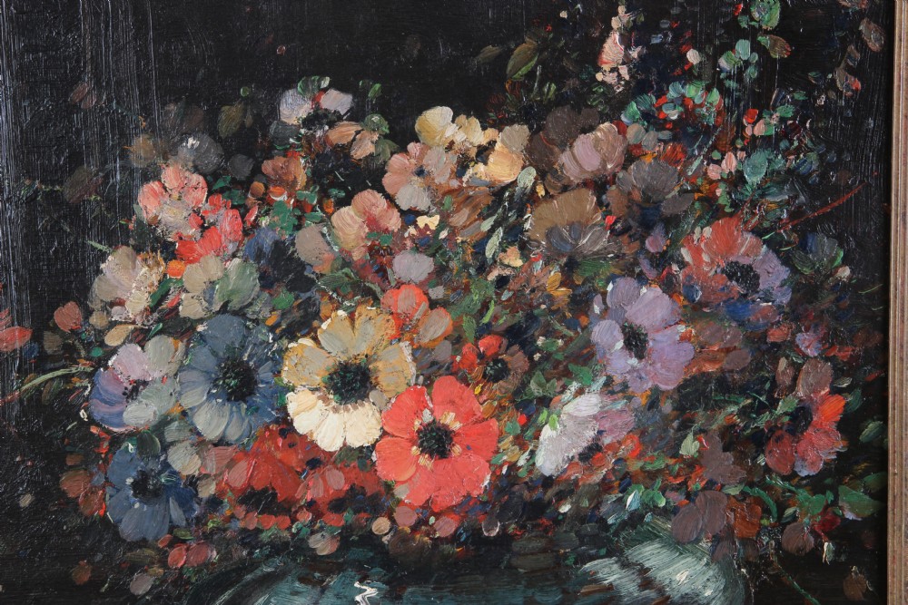 An impressionistic oil painting depicting a colourful arrangement of anemone flowers in a dark vase, presented inside an ornate carved gilded frame. View IV