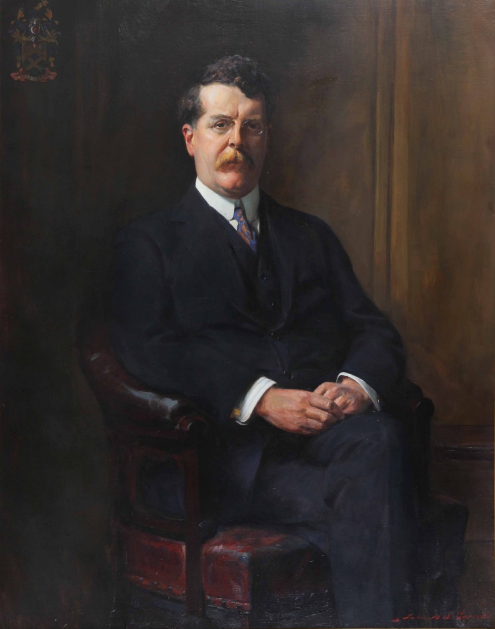 An antique oil painting depicting a seated gentleman wearing a dark suit and spectacles, set within an ornate gilded frame. View II