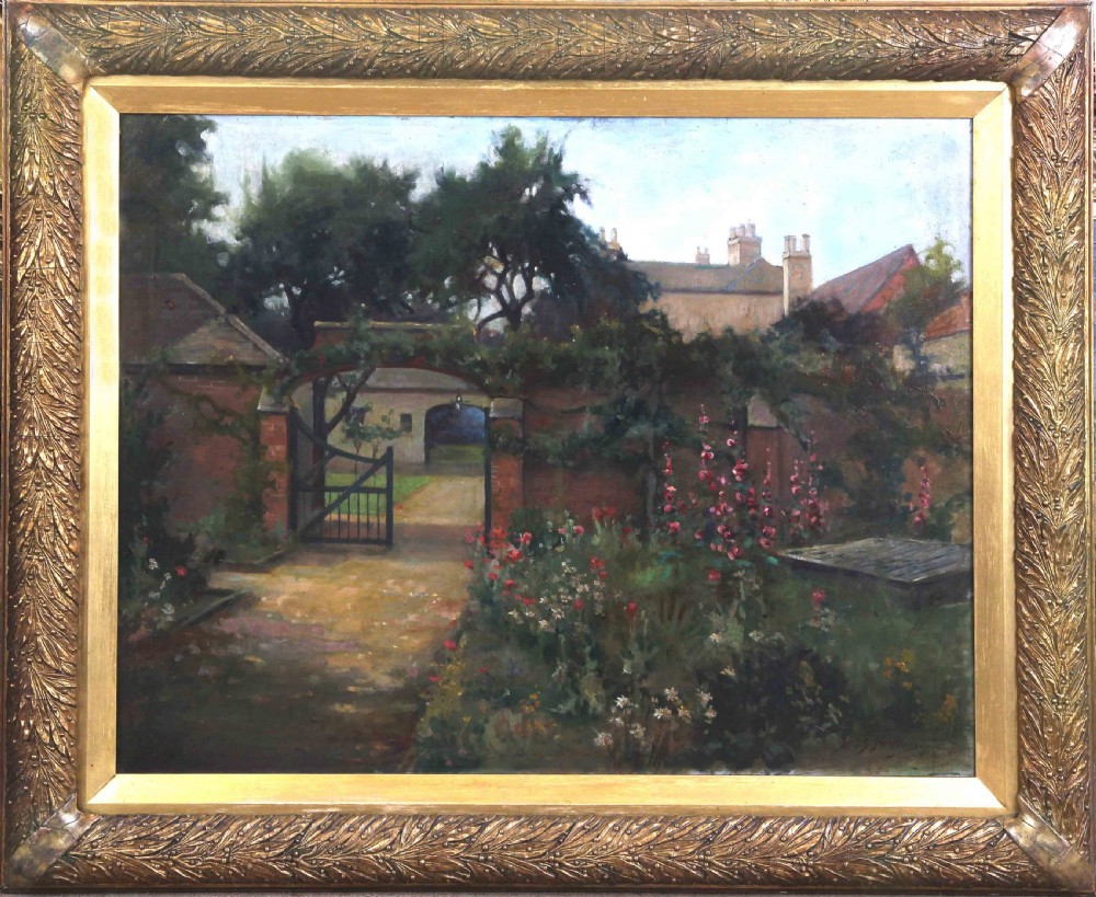 A large landscape oil painting depicting an open garden gate set in a red brick wall leading to a country house, rendered in soft green, pink, and earthy tones within a carved gilded frame.