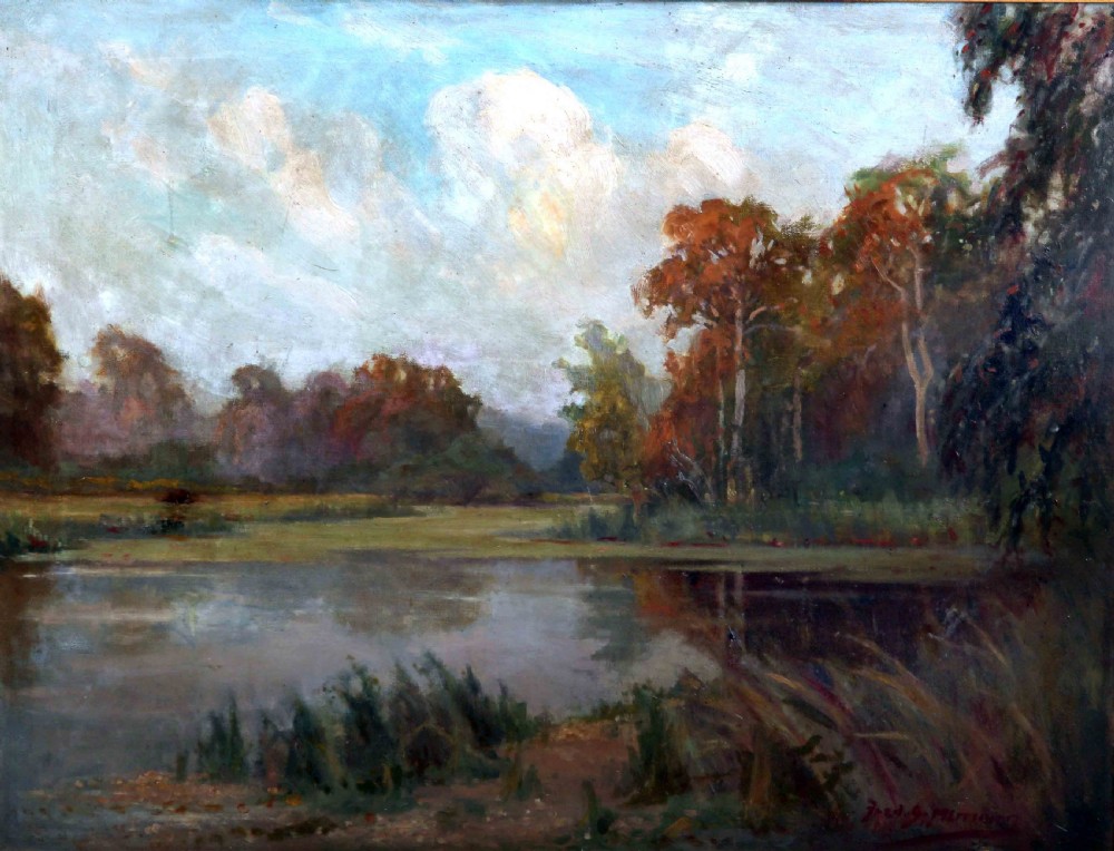 A framed oil painting depicting an autumnal lake landscape with orange trees and reflections on dark water, set within an ornate gilded frame. View II