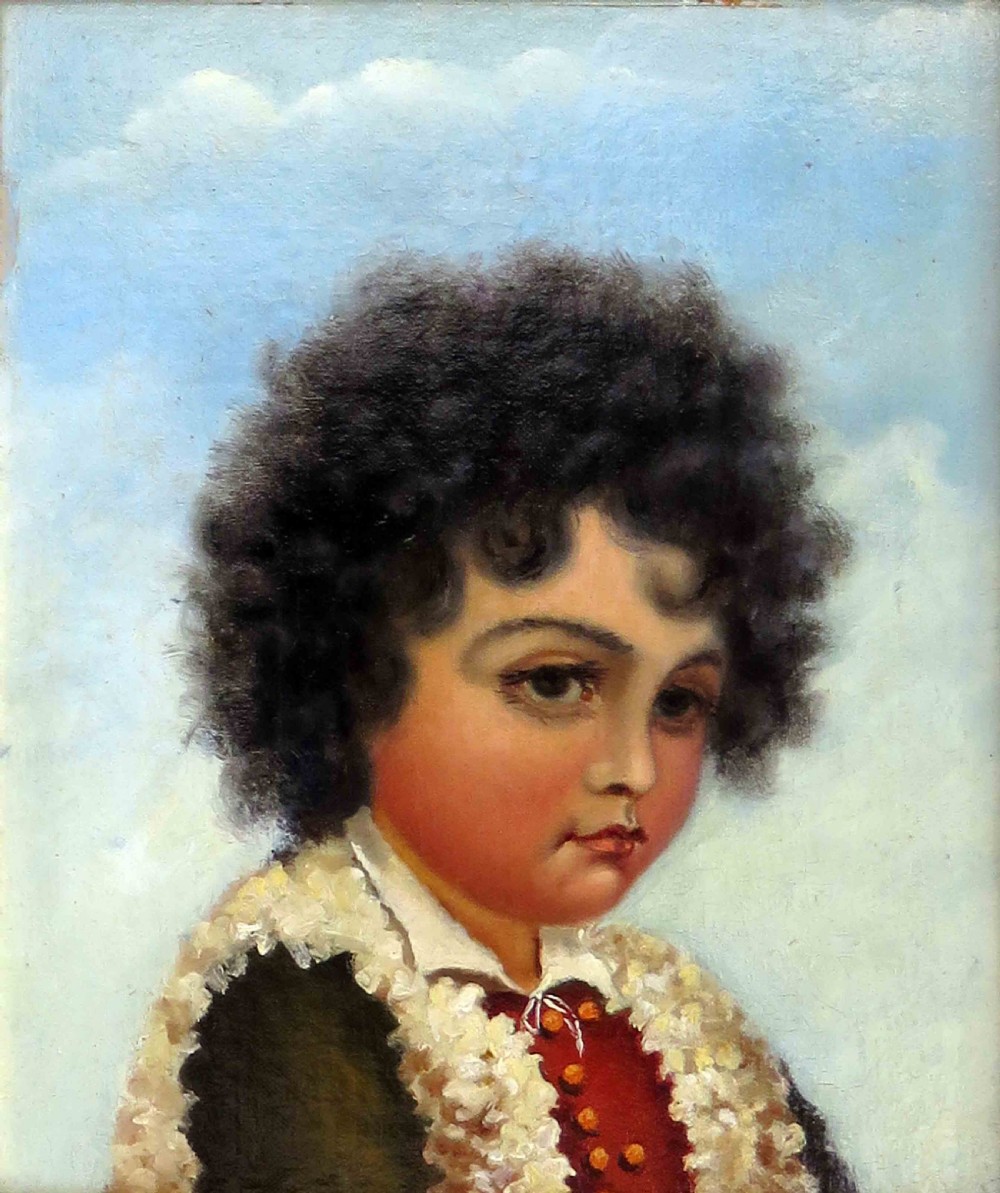 An oil portrait on board depicting a young boy with dark curly hair in traditional attire, framed in a heavily moulded gold gilt frame. View II
