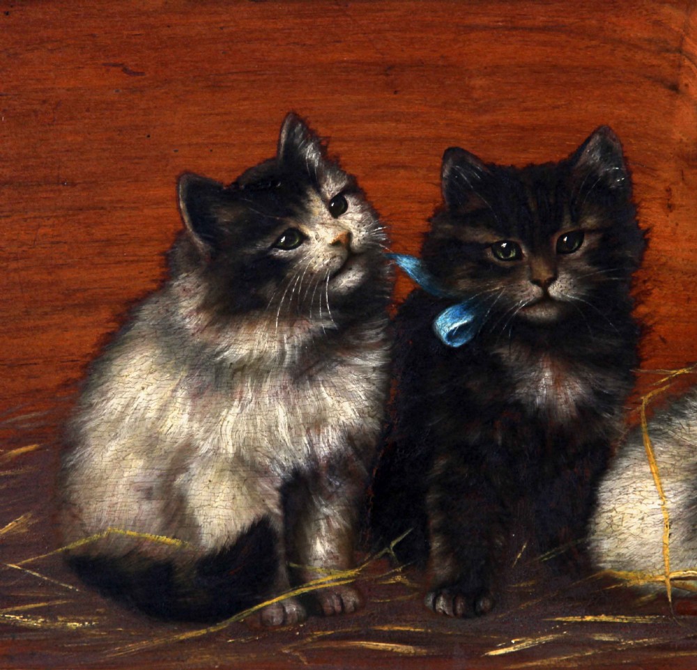 A horizontal oil painting depicting four fluffy kittens resting on straw against a wooden background, set within a heavily carved gilt frame. View III