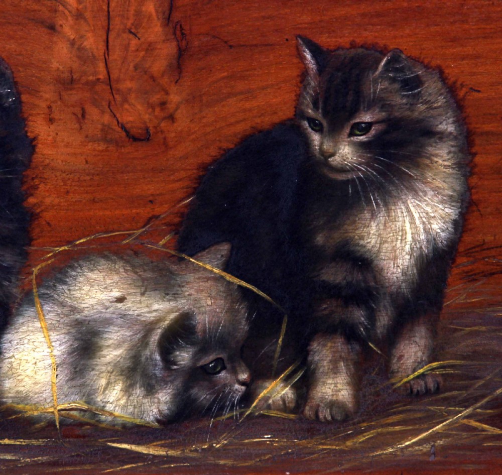 A horizontal oil painting depicting four fluffy kittens resting on straw against a wooden background, set within a heavily carved gilt frame. View IV