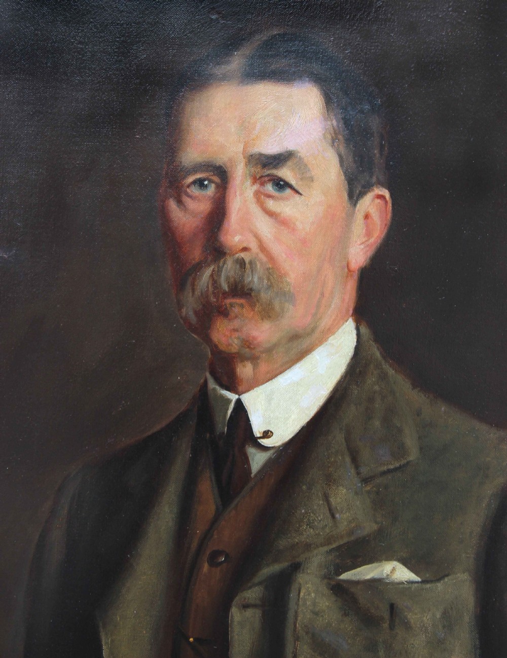 A large framed Edwardian oil portrait painting depicting a standing gentleman in a brown suit against a dark background. View III