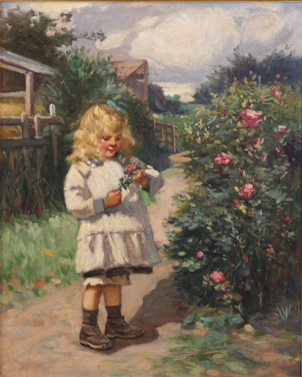 An antique oil painting depicting a young blonde girl holding a flower beside a rose bush in a ornate gilded gesso frame. View III