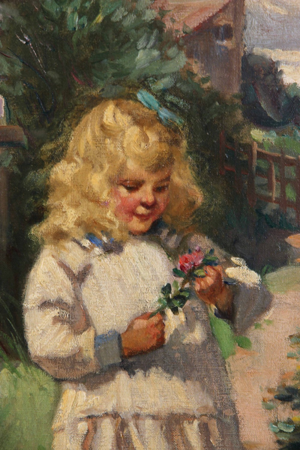 An antique oil painting depicting a young blonde girl holding a flower beside a rose bush in a ornate gilded gesso frame. View VIII