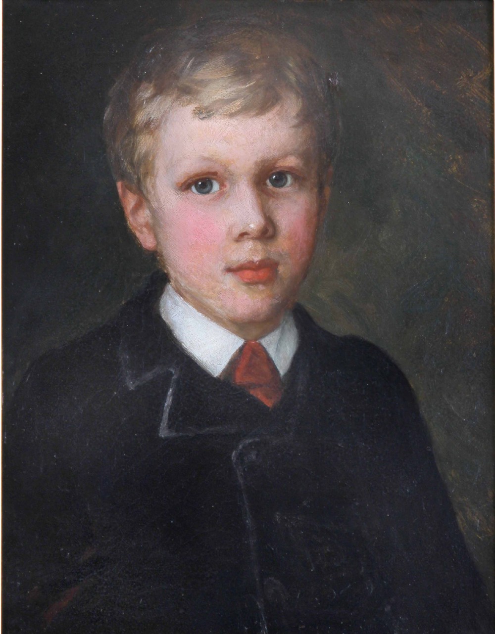 An Edwardian oil painting depicting a young boy in a dark coat, housed inside a decorative gilded frame. View II