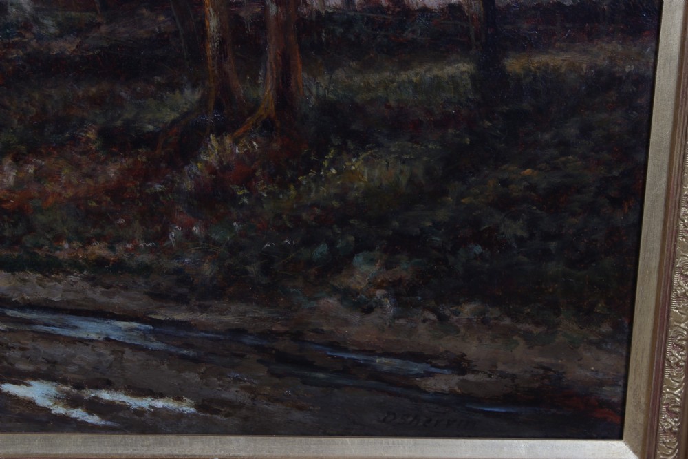 An antique oil painting depicting a rural landscape scene with cottages and tall trees, presented in a moulded giltwood frame. View IV
