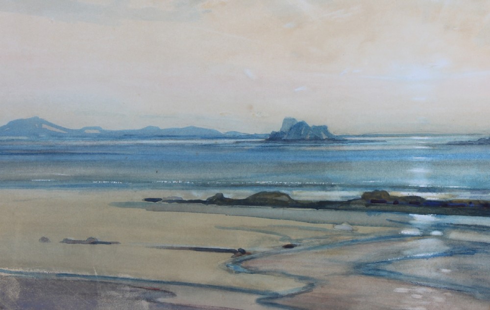 A framed landscape watercolour painting depicting a coastal seascape at sunset with distant mountains, blue waters, and a gold gilt frame. View VII