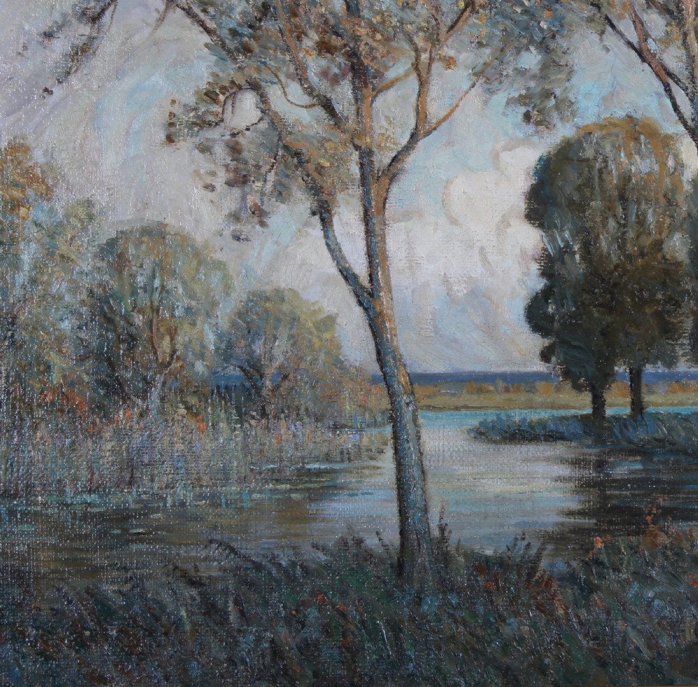 A large impressionistic oil painting depicting a calm lake surrounded by tall leafy trees, set within an ornate gilded frame. View VI