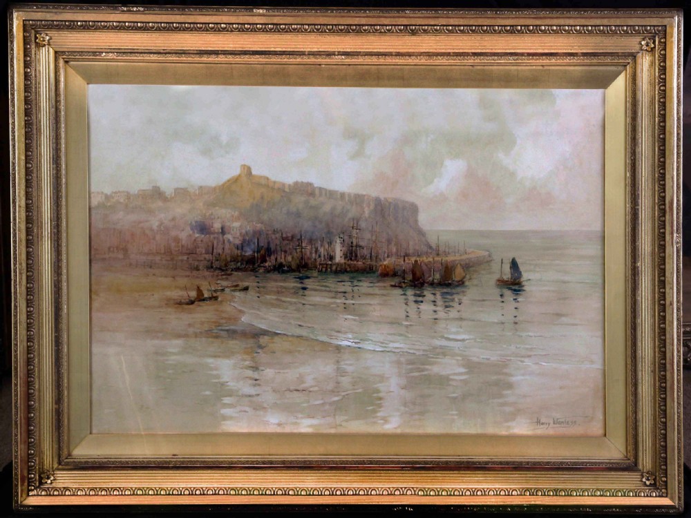 An antique marine watercolour painting depicting Scarborough Harbour with sailing boats in the foreground and a cliffside headland under an overcast sky. View II