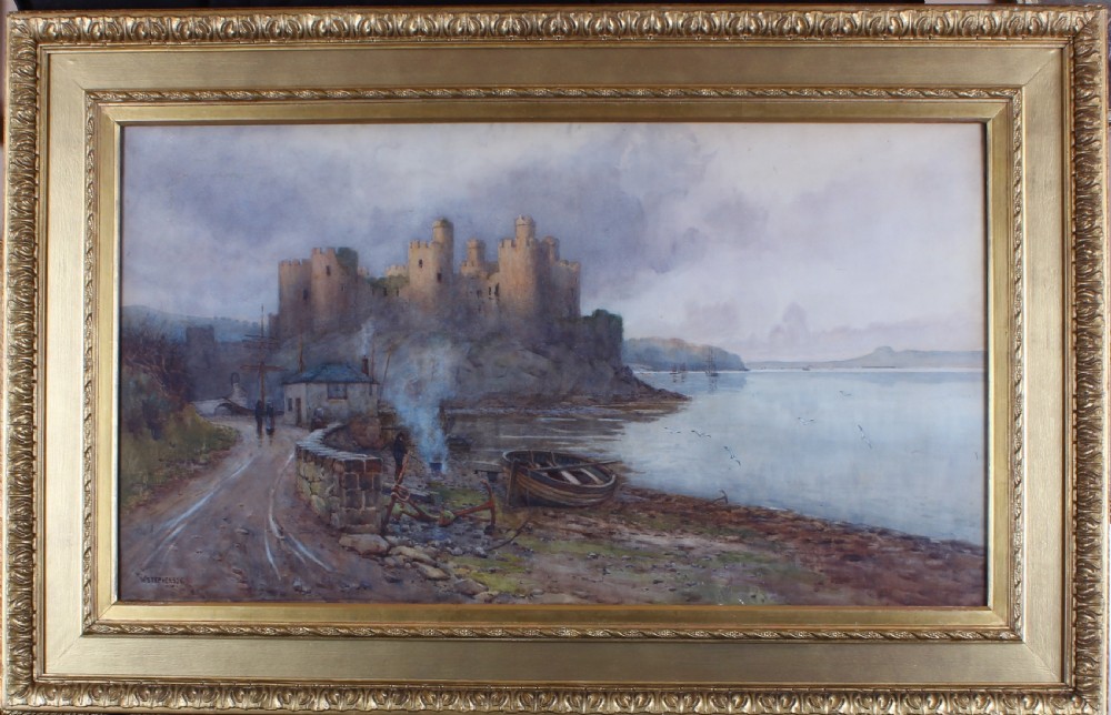 A landscape watercolour painting depicting Conwy Castle on a rocky shore beside a body of water with a small boat and figures in the foreground. View II