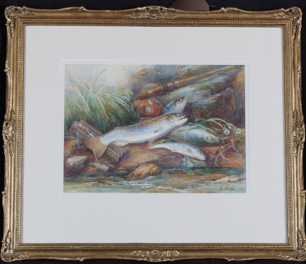 An Edwardian watercolour painting depicting freshly caught trout resting on a grassy riverbank alongside a fishing rod and reel. View II