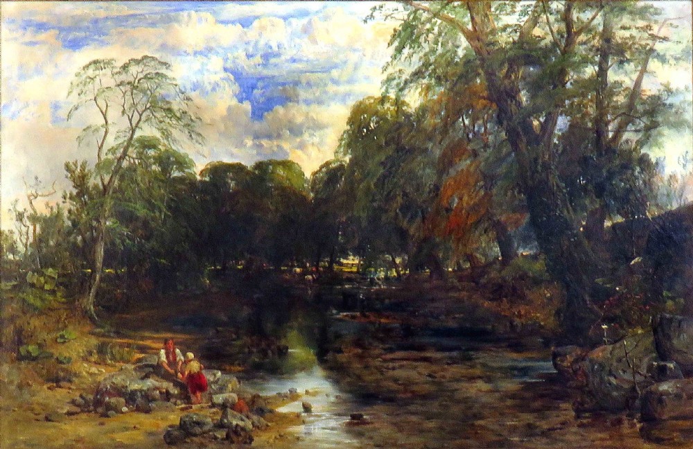An oil painting on canvas depicting a woodland landscape with trees, a river bed, a cloud-filled sky, and small figures near the water.