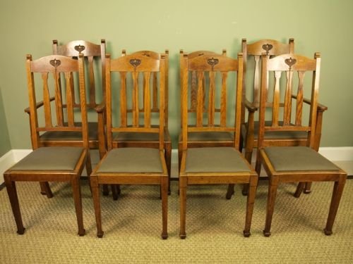 A Set of 8 Oak Dining Chairs by Shoolbred