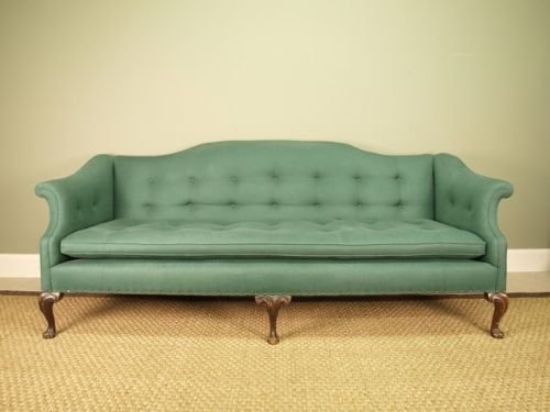 An Impressive Large Upholstered Camel Back Sofa