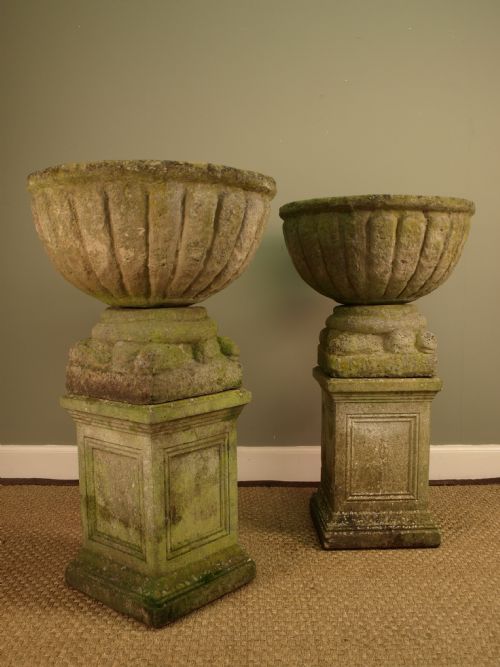 A Pair of Large Urns on Stands