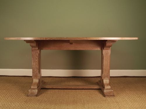A Large Oval Oak Dining Table