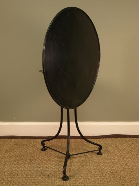 An Unusual French Tilt-top Iron Café Table