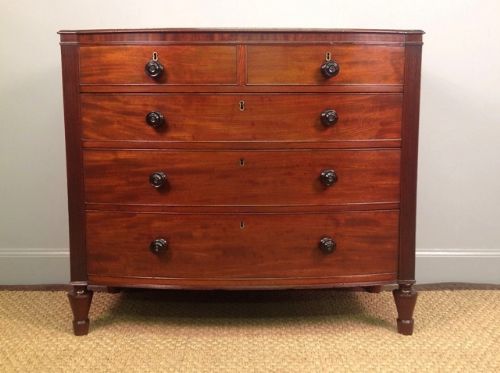 A  Small Regency Mahogany Bow Front Chest