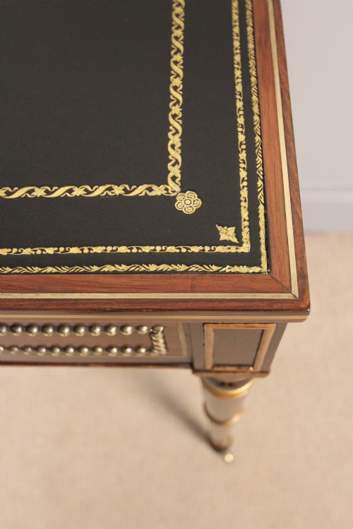 fig 4. A Regency Rosewood & Parcel Gilded Writing Table