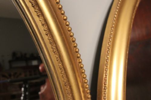 fig 2. A Pair of Giltwood Oval Mirrors