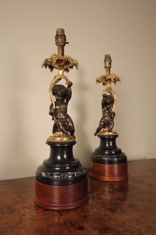 A Pair of Bronze, Ormolu & Marble Cherub Lamps