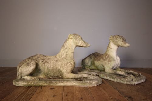 A Pair of Composite Stone Greyhounds