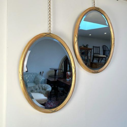 A Pair of Edwardian Giltwood Oval Mirrors in the Georgian Style