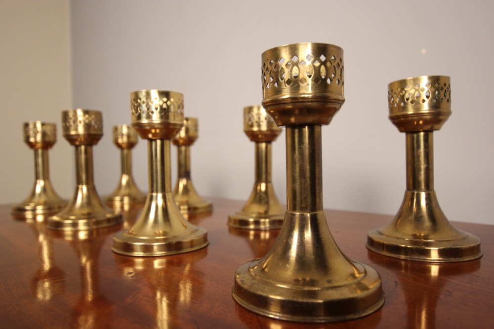 A run of 8 Decorative Brass Candlesticks