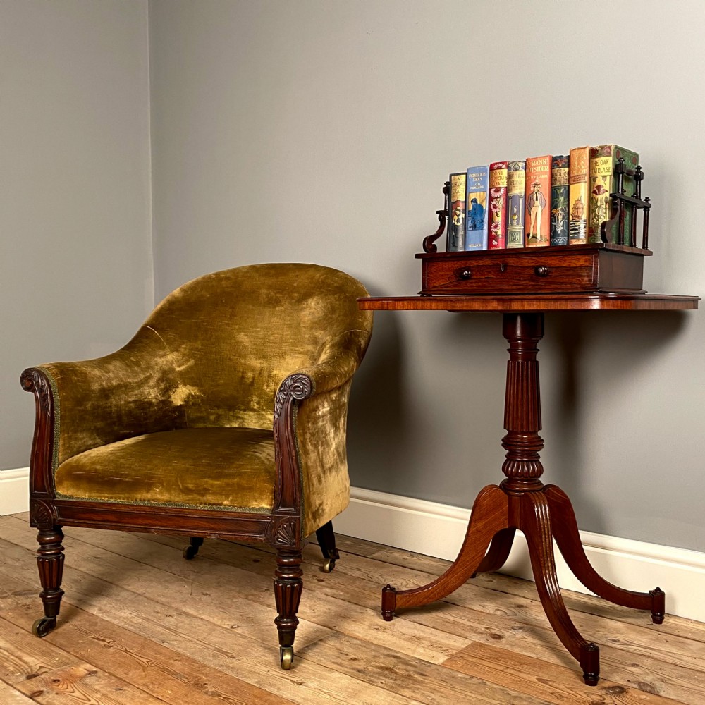 A Regency mahogany occasional table with a rectangular top, reeded pedestal column, and tripod base. View VII