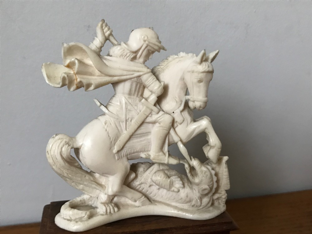 Antique ivory figure of St George slaying the dragon