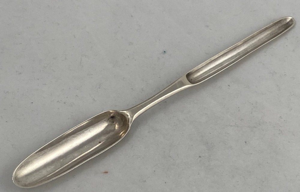 An eighteenth-century Georgian Irish sterling silver marrow scoop featuring a narrow elongated double-ended design. View II