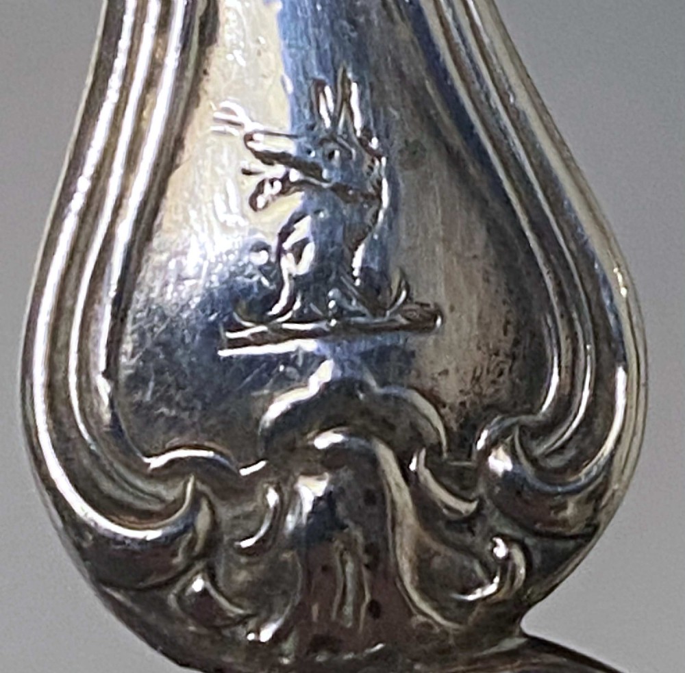 A pair of Victorian sterling silver grape scissors featuring Albert pattern handles with reeded finger loops. View IV