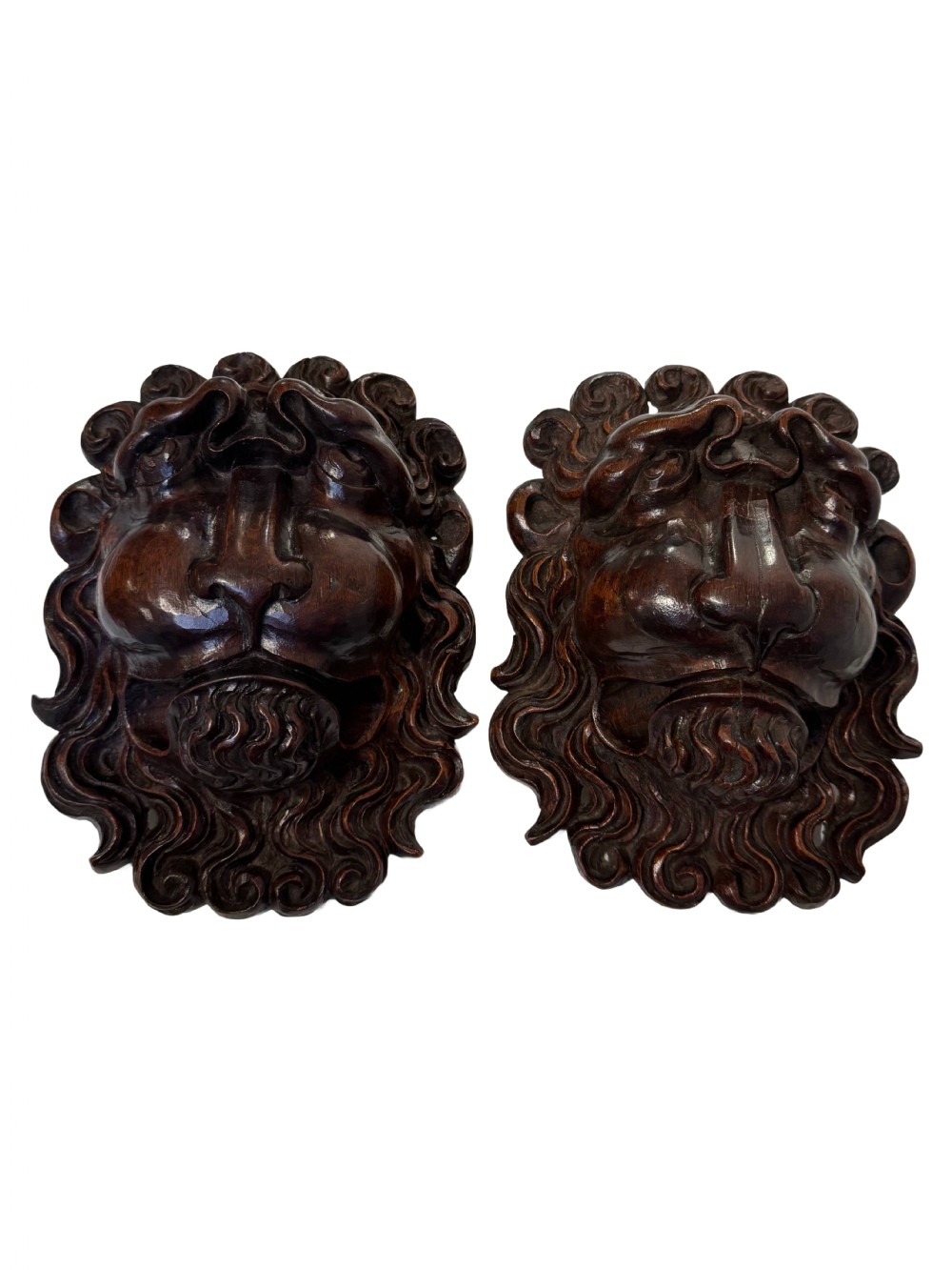 18th Century carved lion faces
