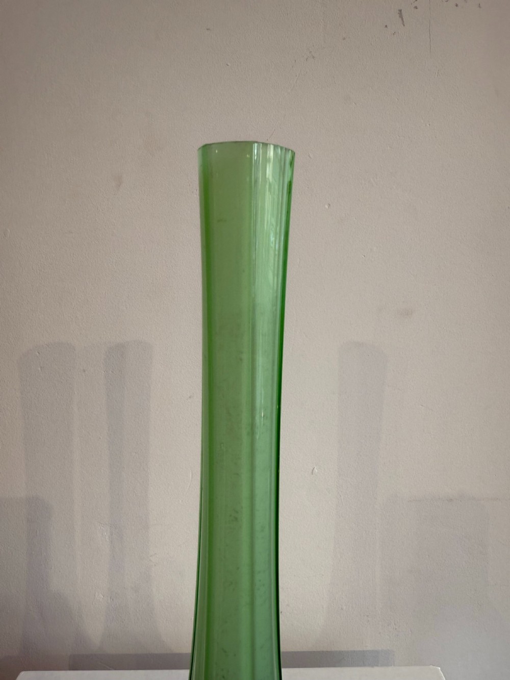 A pair of tall French hand-blown art glass vases featuring slender green necks resting on bulbous burgundy spattered bases with pinched feet. View IV