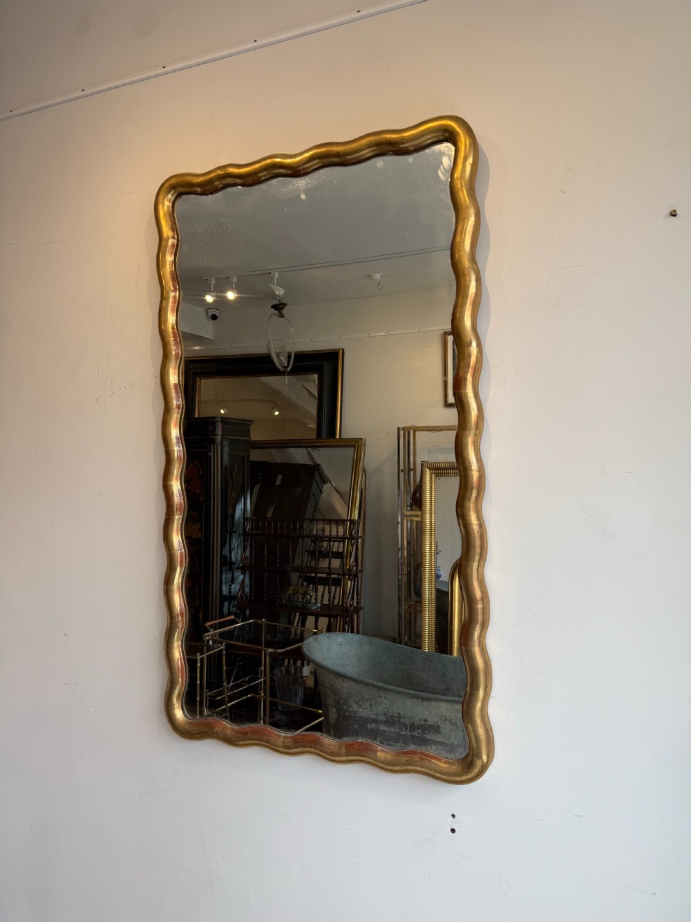 French wavy edge gilt mirror