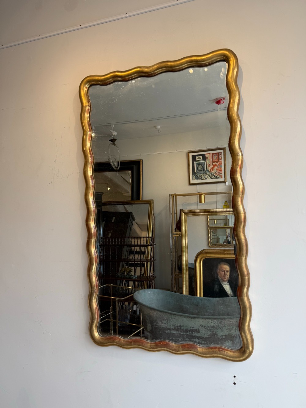French wavy edge gilt mirror View II
