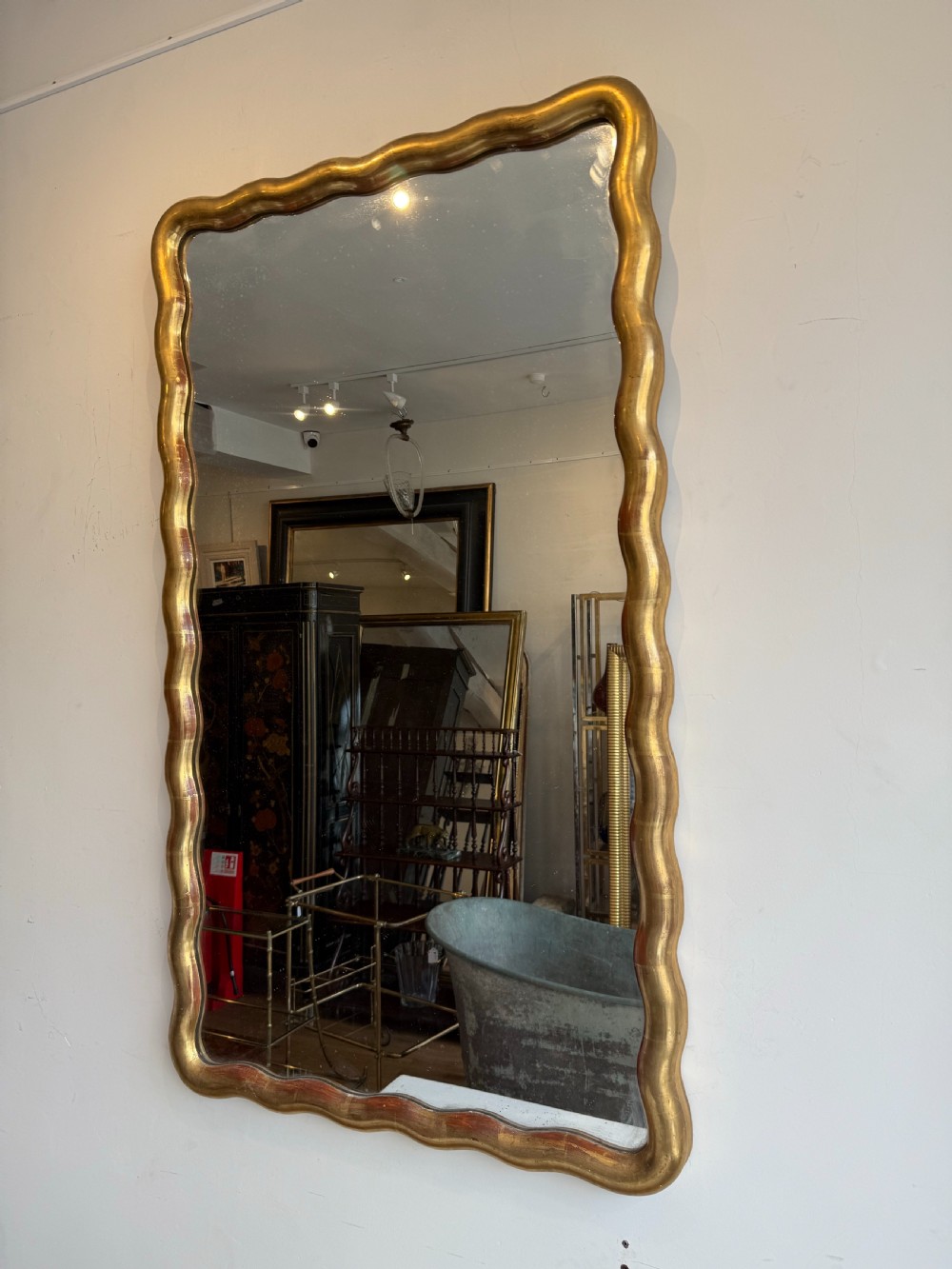 French wavy edge gilt mirror View III