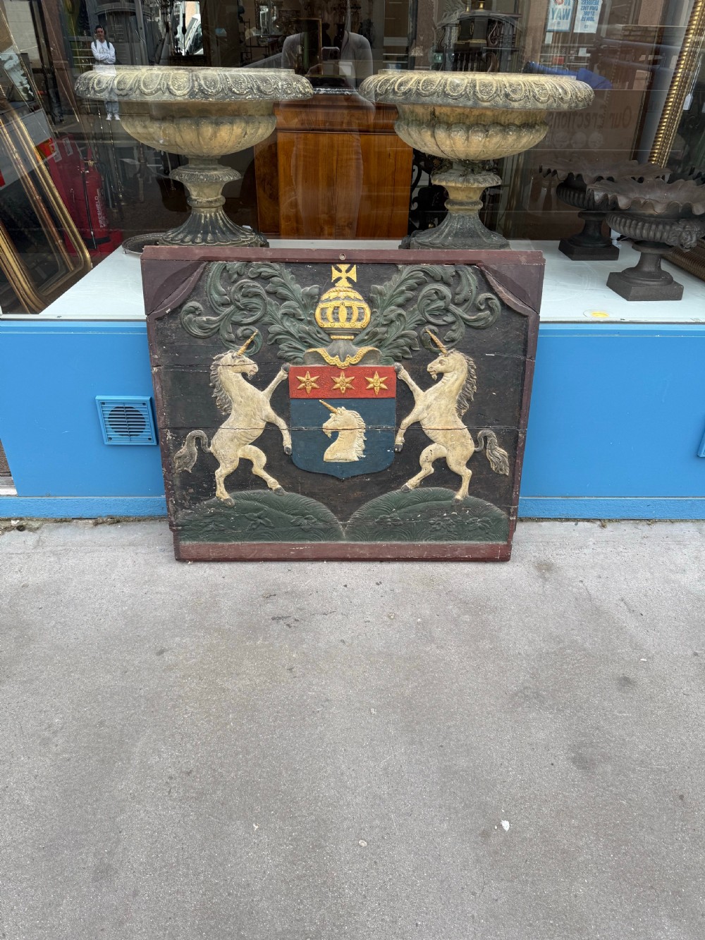 Carved coat of arms depicting unicorns View II